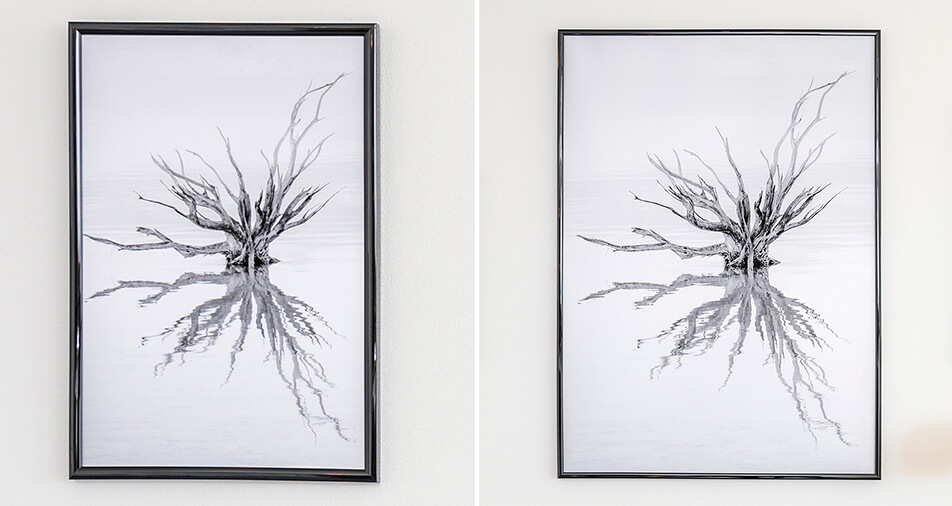 Kaksi kiiltävän mustaa kehystä mustavalkoisella kuva-aiheella